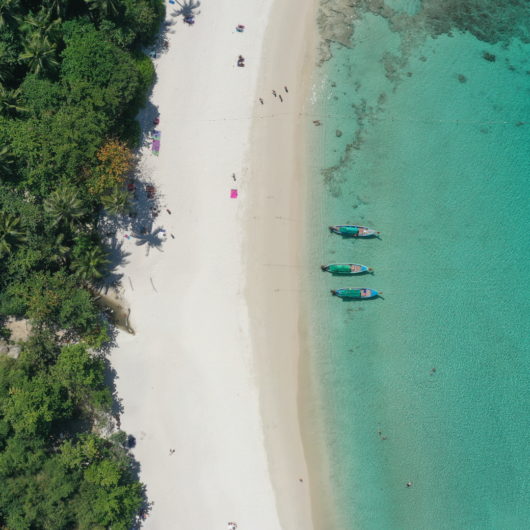 Longtail boats along one of Thailand's beaches