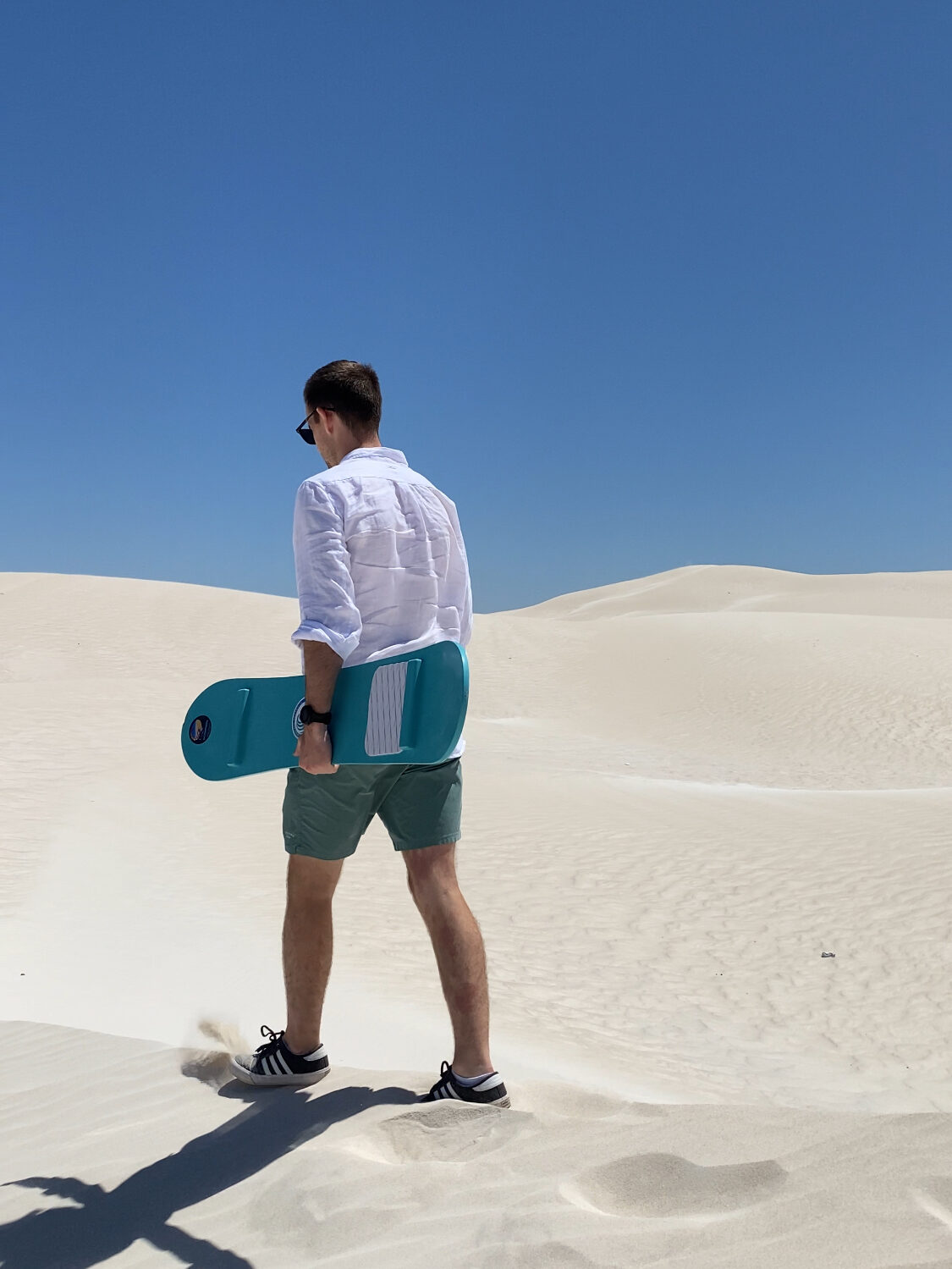 Daniel walking with sandbar in the sand dunes in Lancelin, Western Australia