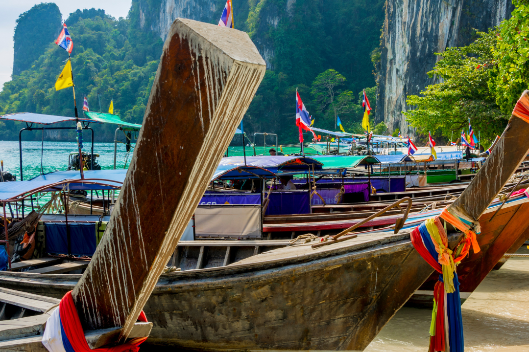 Longtail boats docked at beautiful Thai beach