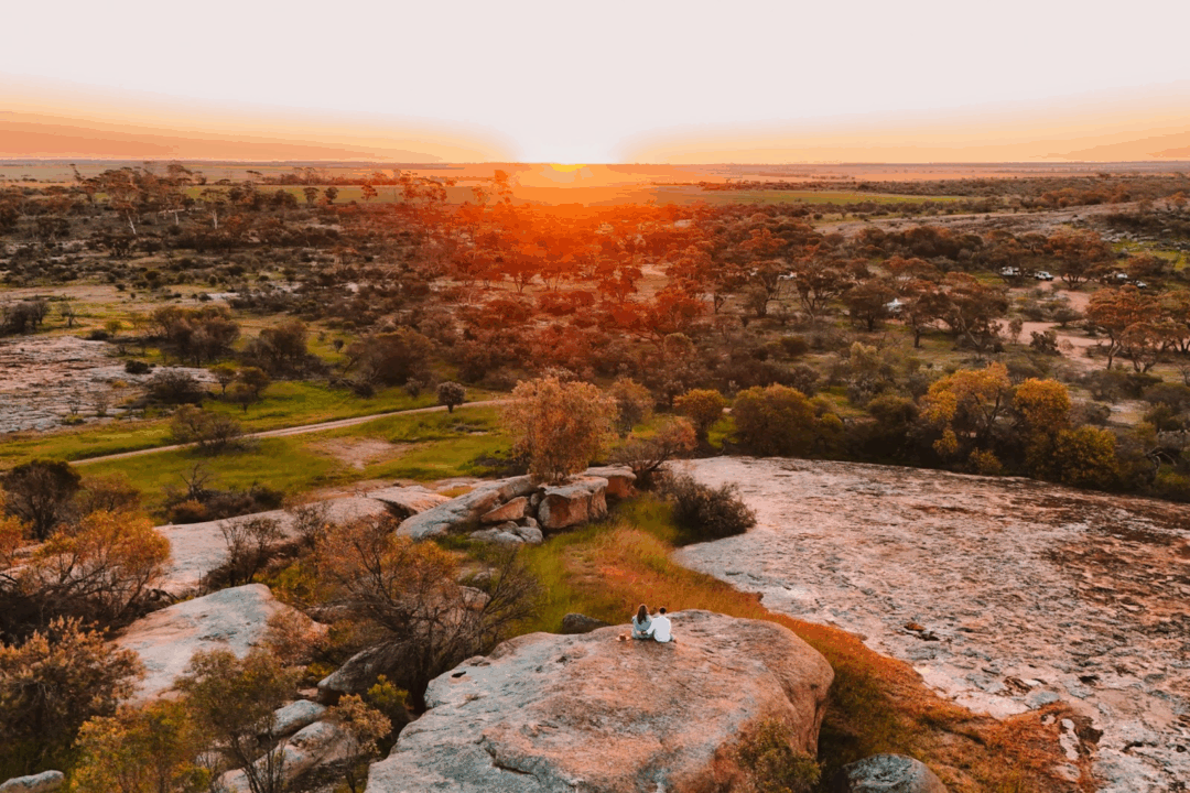 Golden glow over the Wheatbelt from the top of Marshall Rock (Wheatbelt Way Road Trip Itinerary)

